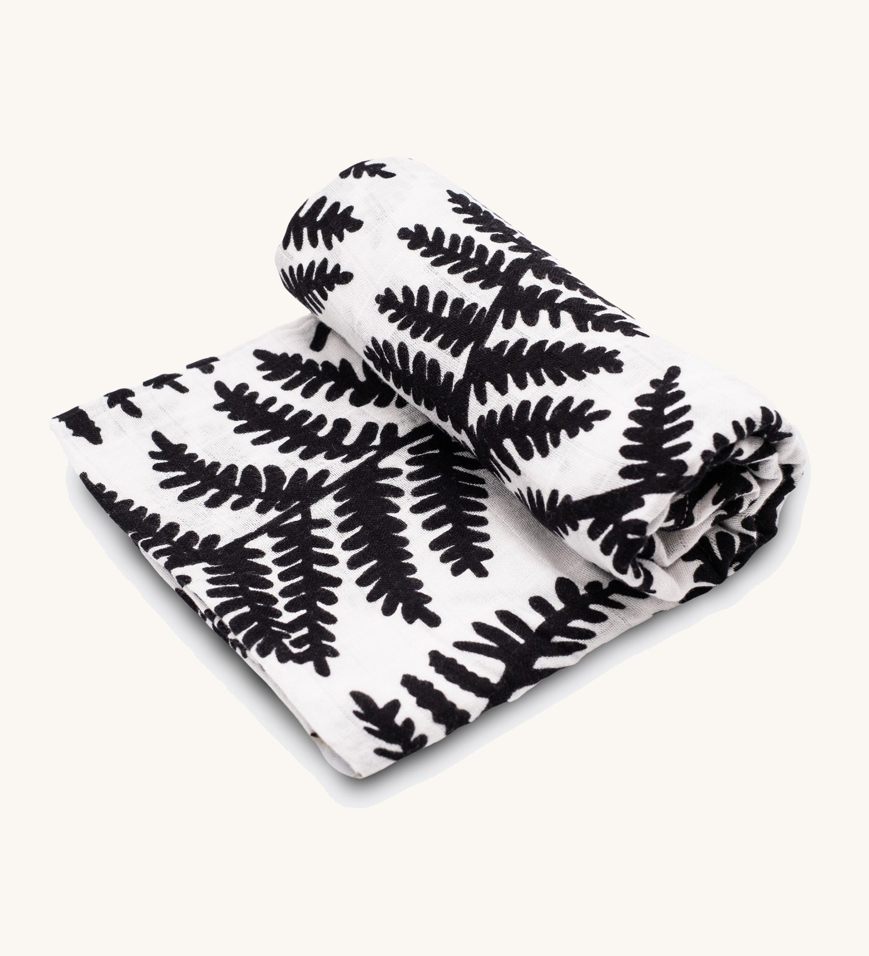 Etta Loves Extra Large Organic Cotton Baby Muslin Square - Fern, made from GOTS organic cotton with a black leafy fern print. On a cream background