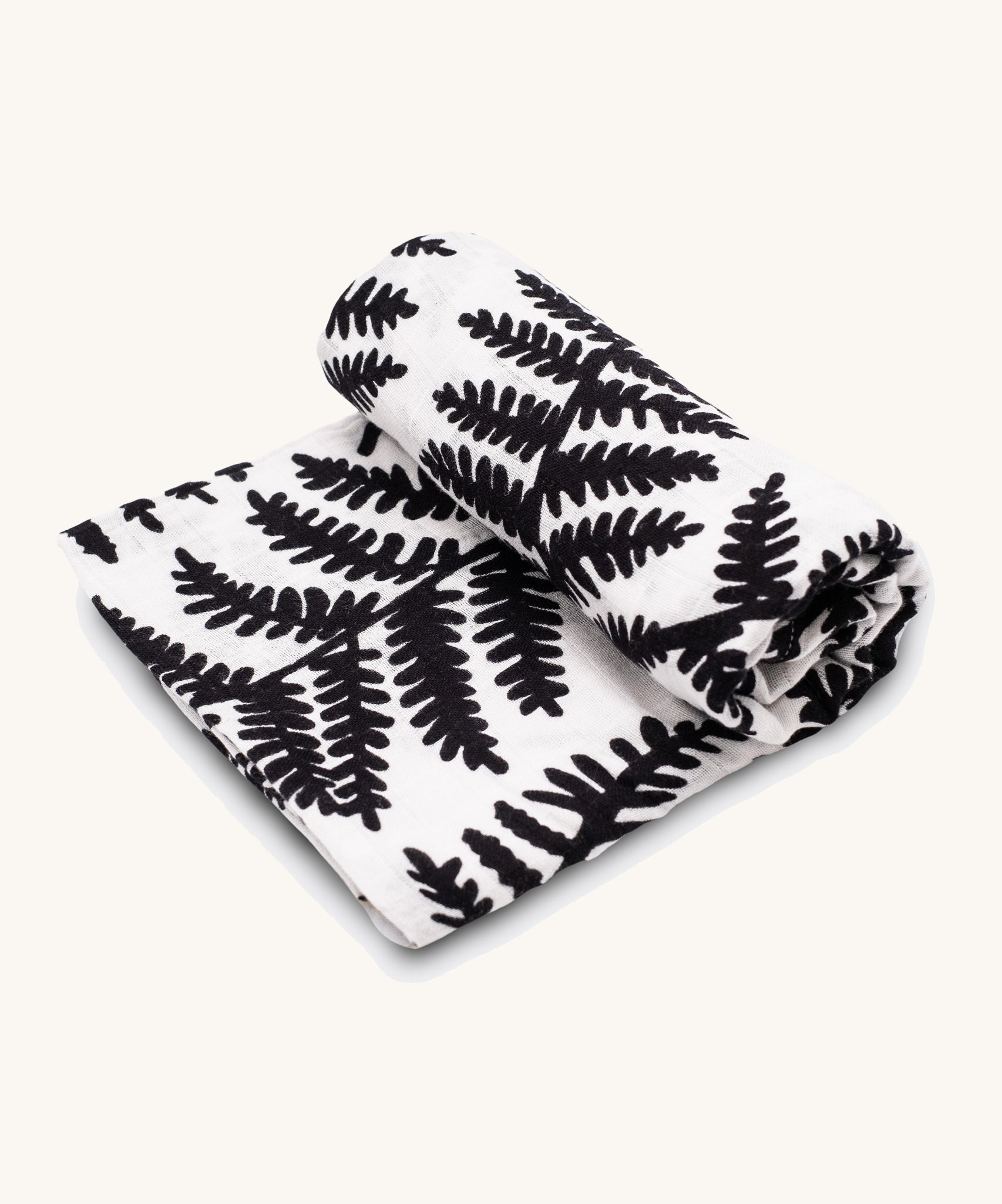 Etta Loves Extra Large Organic Cotton Baby Muslin Square - Fern, made from GOTS organic cotton with a black leafy fern print. On a cream background