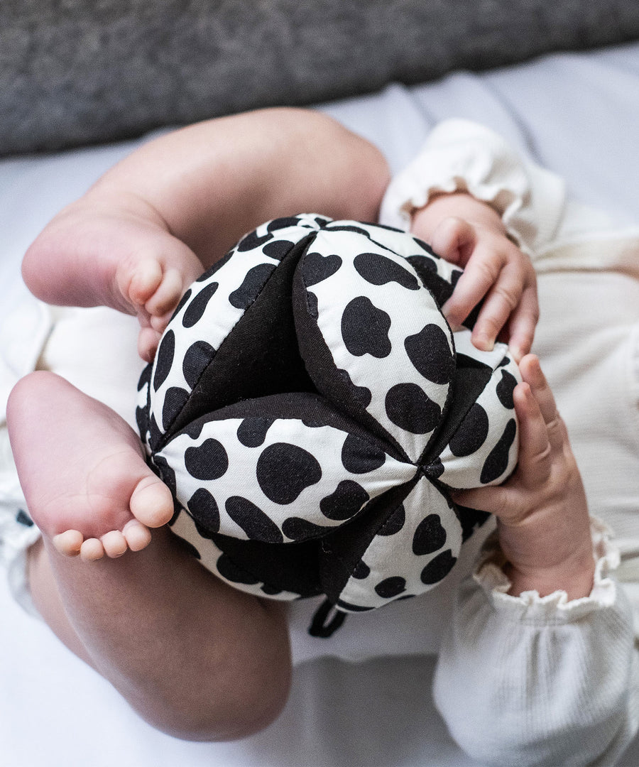 A closer look at the Etta Loves Organic Sensory Grasping Ball with black and white spots