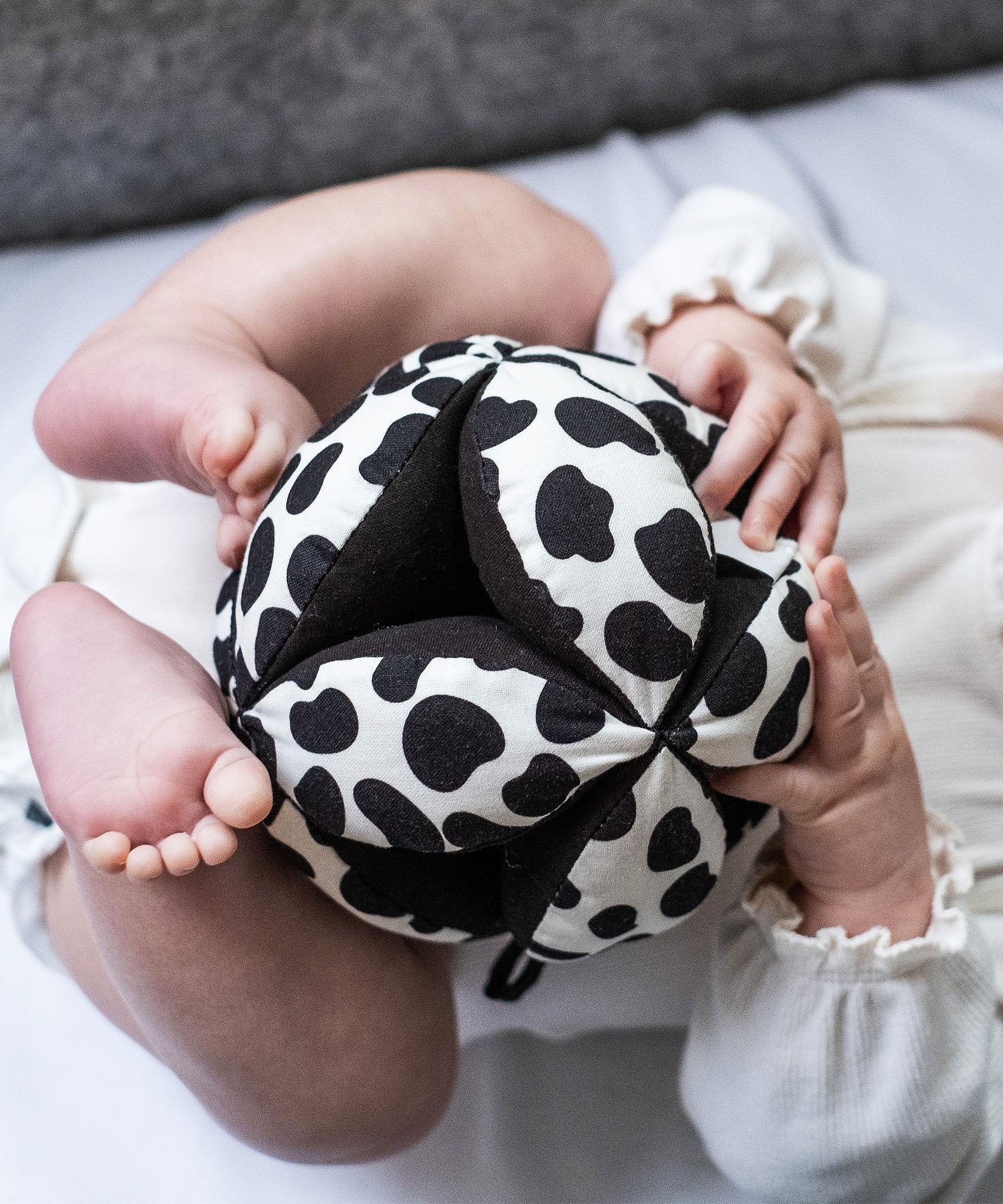 A closer look at the Etta Loves Organic Sensory Grasping Ball with black and white spots