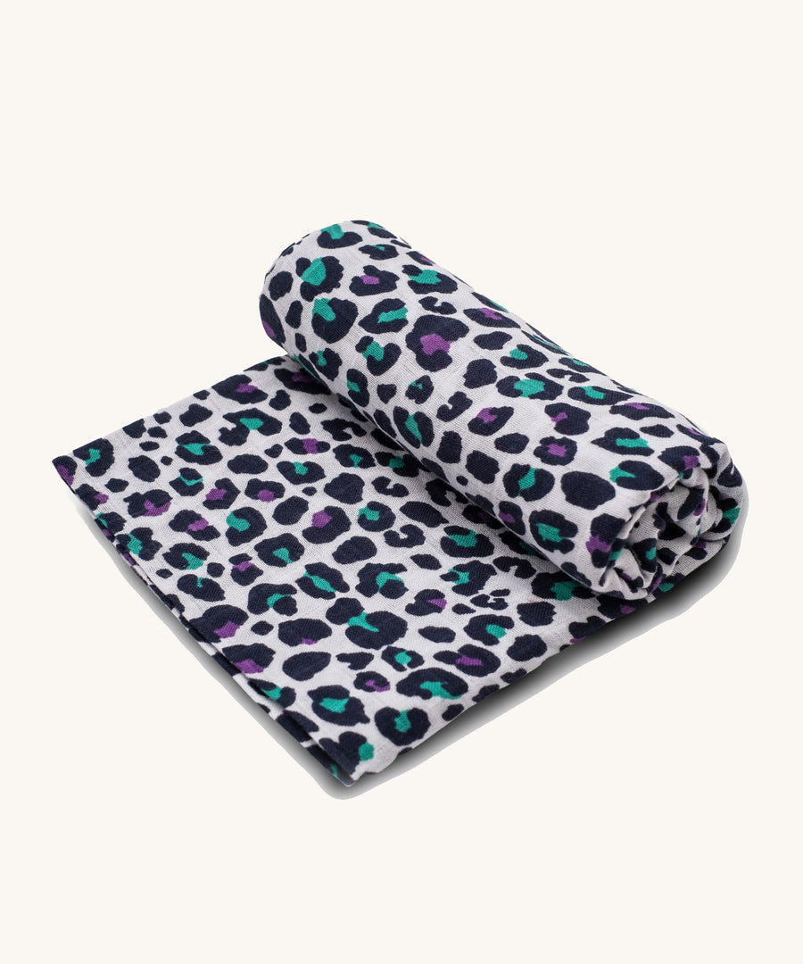 Etta Loves Extra Large Organic Cotton Baby Muslin Square - Purple Leopard. Made from GOTS Organic Cotton, with purple and green sports with a black outline, on a cream background