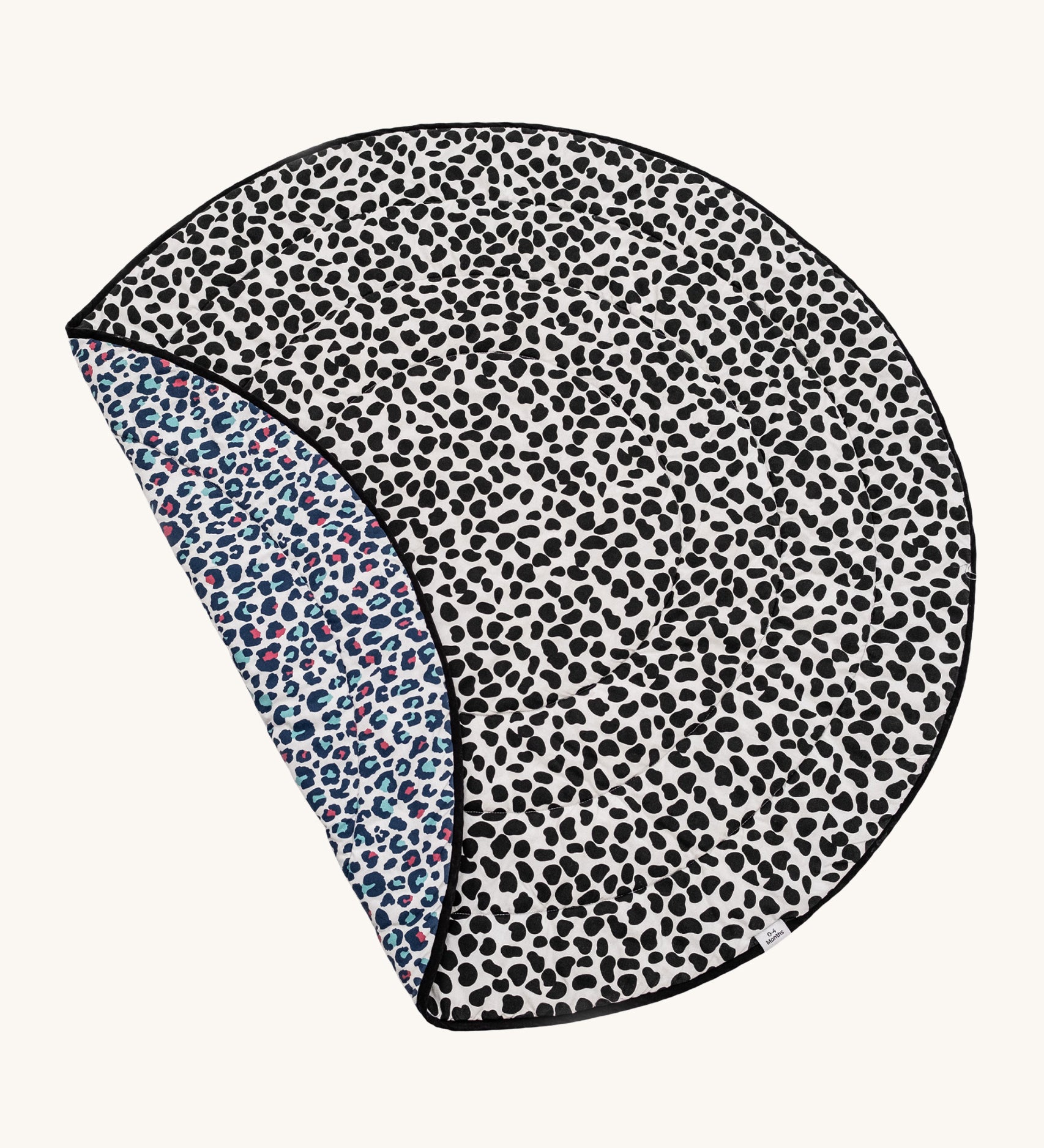 Etta Loves Reversible Organic Cotton Baby Play Mat - Animal Print, with a fun, black, spotty Dalmatian print on one side, and a colourful Leopard print on the other