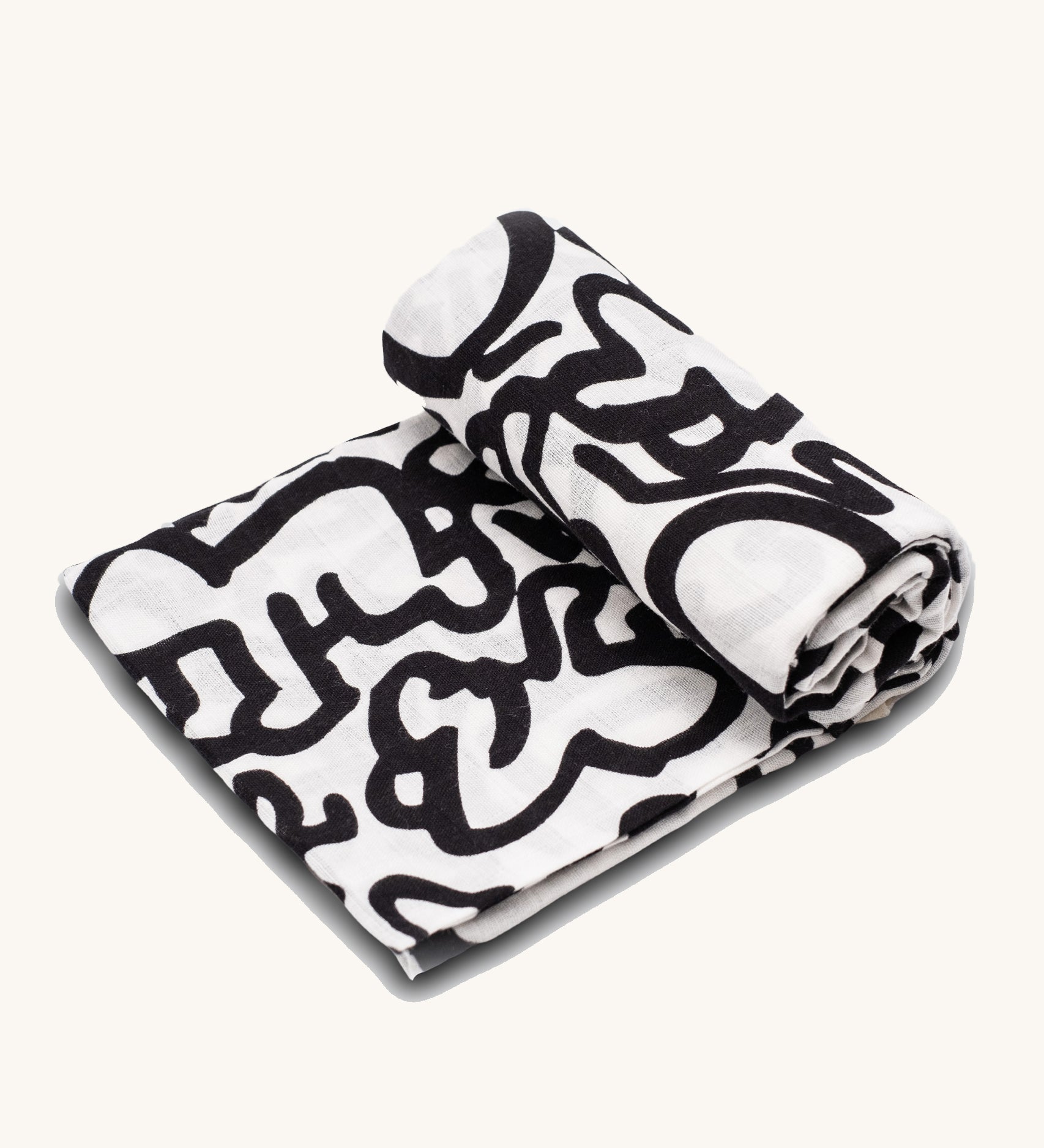 The Etta Loves X Keith Haring Extra Large Organic Cotton Baby Muslin Square - Baby, with a high-contrast black and white design crawling baby design 