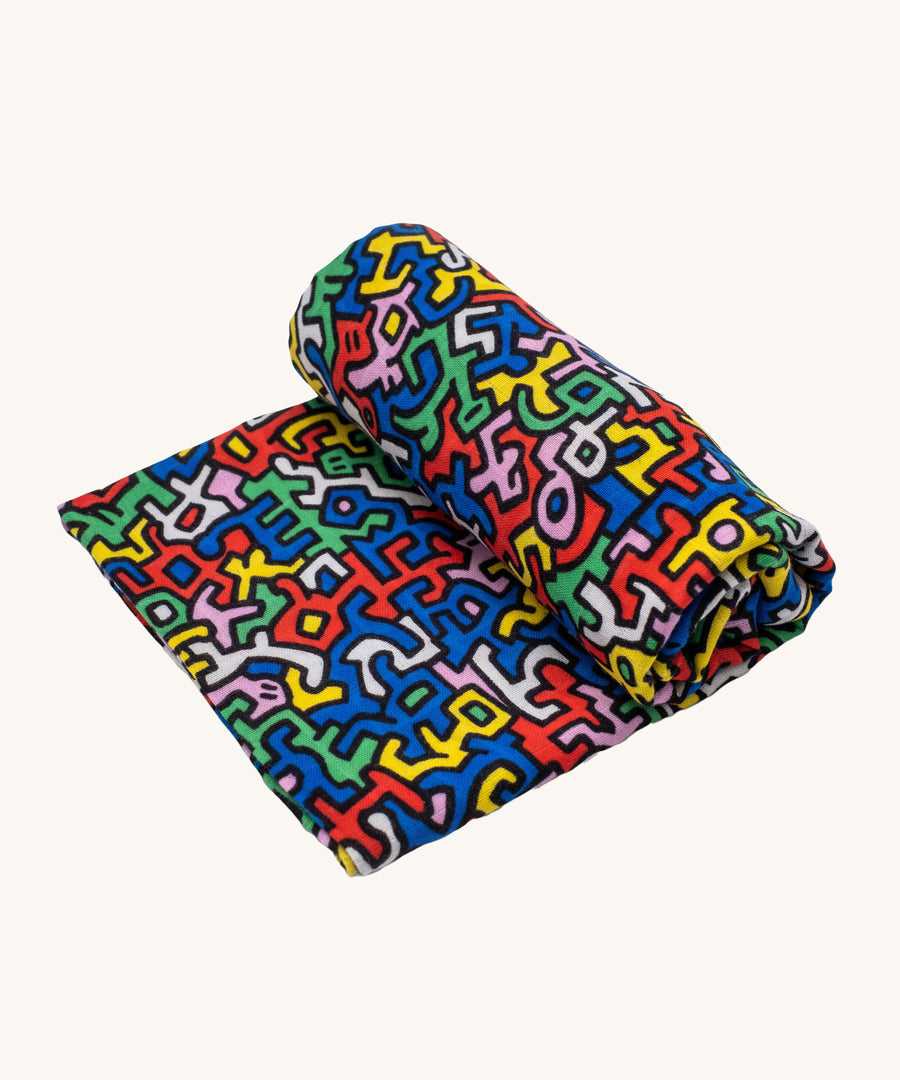 Etta Loves X Keith Haring Extra Large Organic Cotton Baby Muslin Square - Brazil, with strong, colourful shaped print 