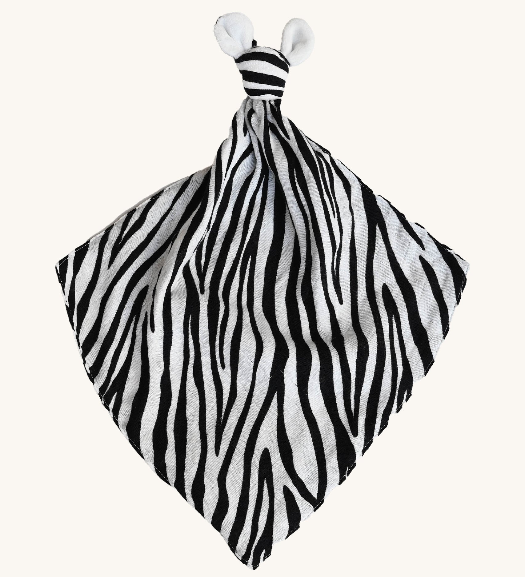 Etta Loves Organic Zebra Comforter in Zebra Print. A soft and cuddly Zebra Print comforter in black and white stripes, a knotted top and two soft zebra ears on a cream background