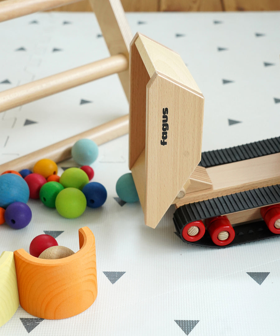 Fagus Wooden Caterpillar Dumper Truck. The image shows the adjustable tipper at the back in an upright position