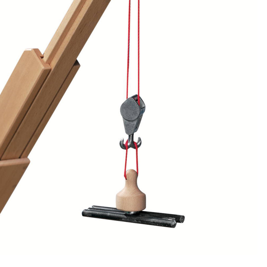 Fagus eco-friendly wooden toy crane magnet attachment hanging on from a red string on a white background