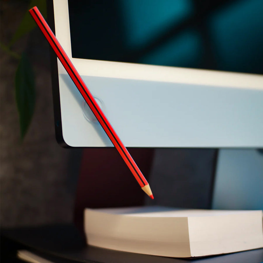 a fixits dot used to attach a pencil to a computer monitor