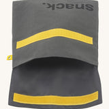 Fluf opened cotton snack pack with a flip yellow velcro in dark grey colour with snack printed on the front in black  