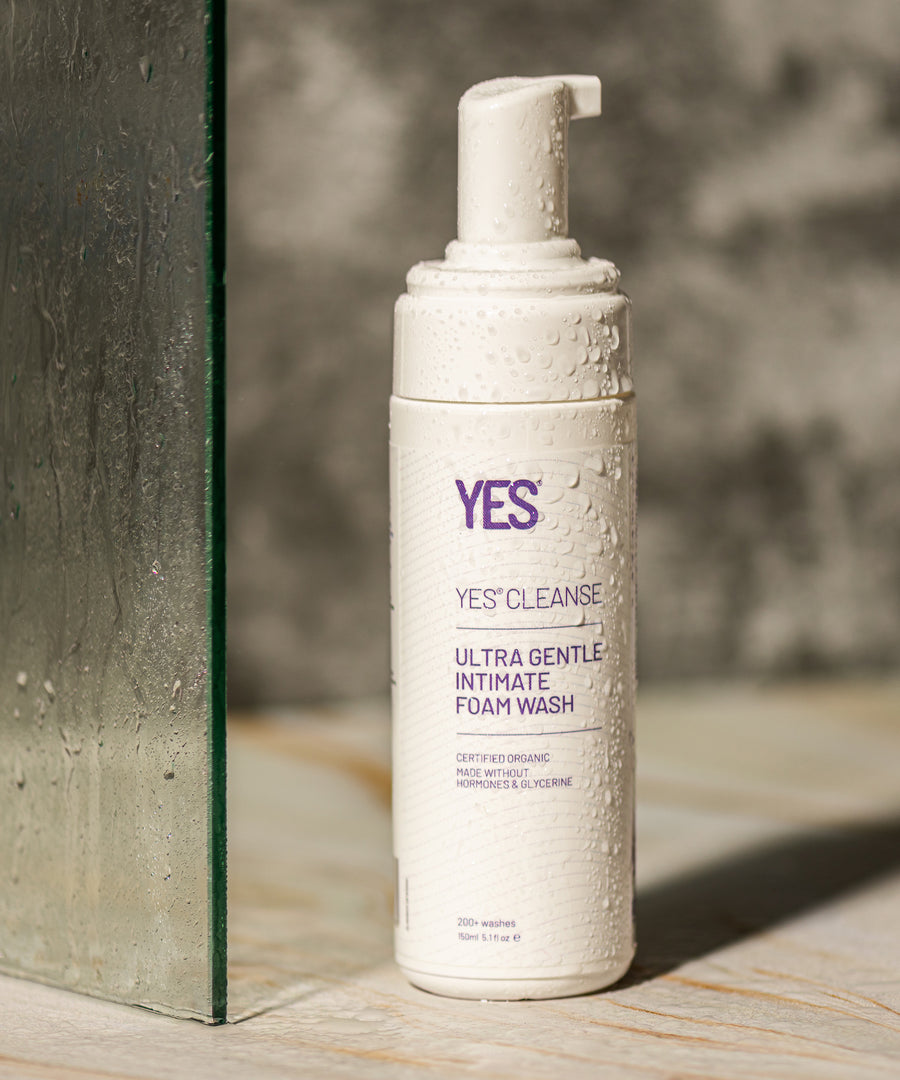 The Yes Cleanse Intimate Wash Fragrance Free -150ml on a shower floor