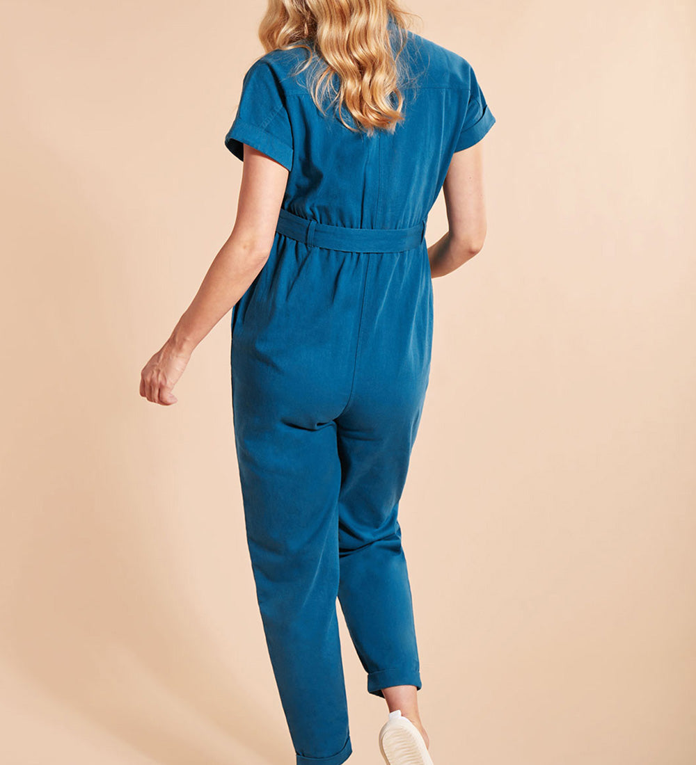 Woman wearing the Frugi Adult deep sea blue coloured Hannah Maternity Jumpsuit showing the back of the outfit