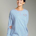 Woman wearing the Frugi eco-friendly meg maternity and nursing striped pyjama top on a grey background