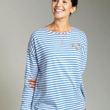 Woman wearing the Frugi eco-friendly meg maternity and nursing striped pyjama top on a grey background