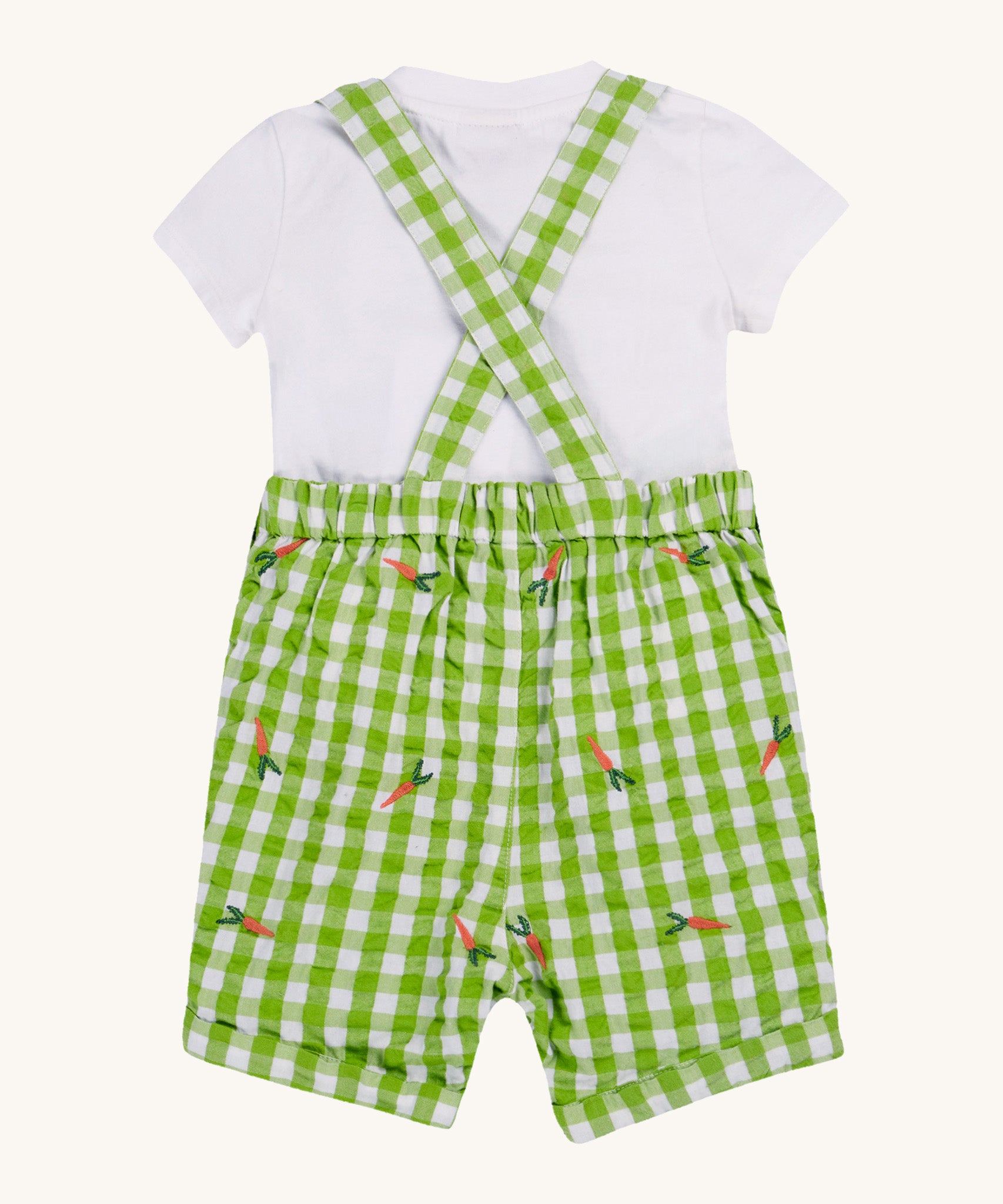 Frugi kids Alfred dungarees outfit, macaw gingham carrots - GOTS organic cotton kids dungaree outfit with a white short sleeve t-shirt and green gingham dungaree with a elasticated waist band. Features orange carrots embroidery scattered on the dungaree. 