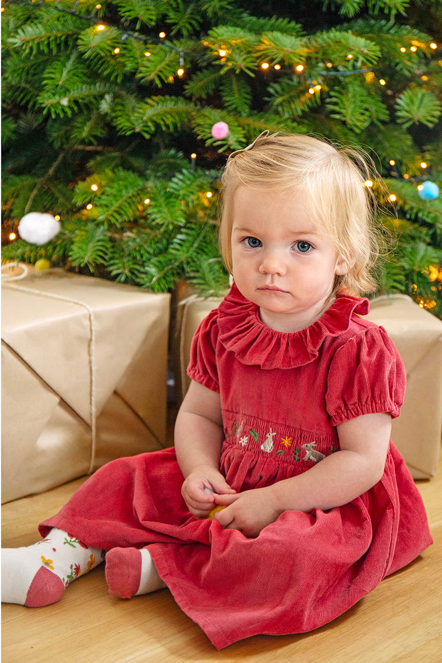 a girl wearing frugi amilie party outfit