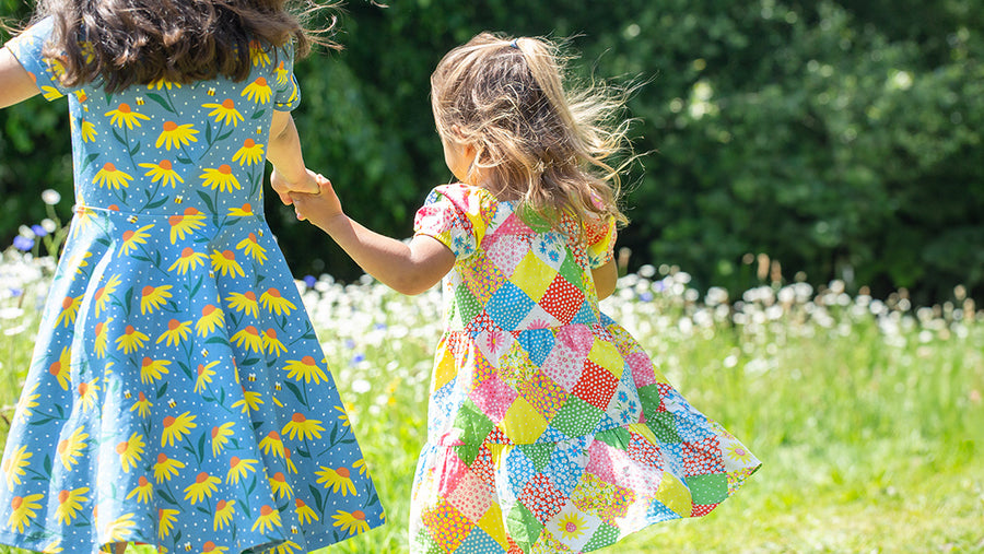 children wearing frugi dresses