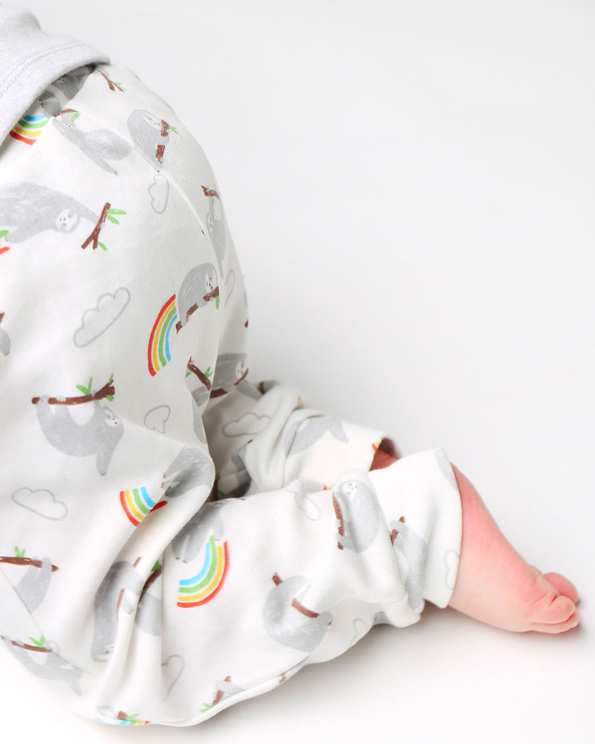 A closer look of the white cuffed sloth and rainbow pull ups with a folded waistband