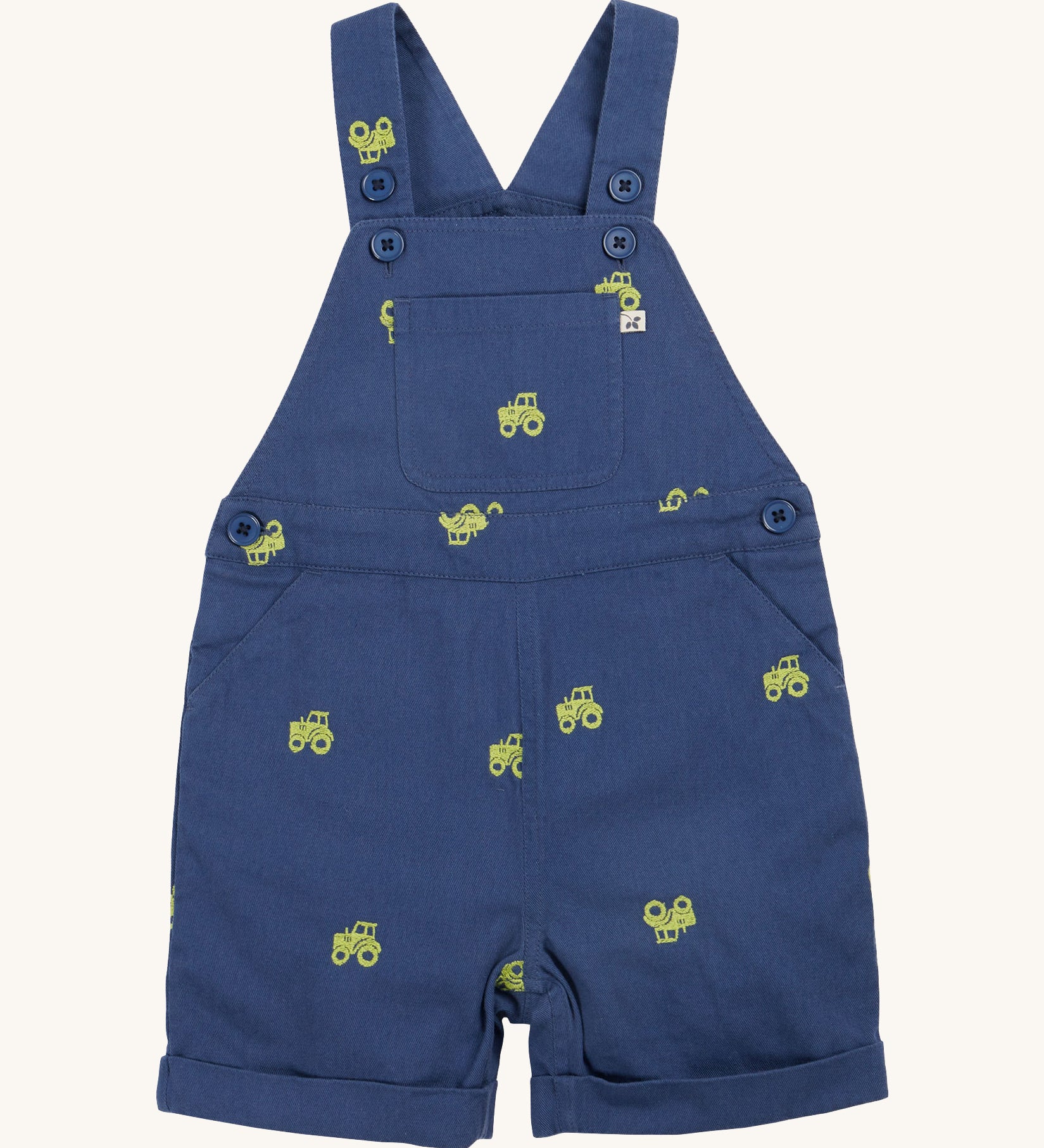 Frugi baby short navy tractor dungarees - GOTS organic cotton baby dungarees in navy blue with a button settings on the shoulder straps for easy fitting. Features a yellow tractor embroidery all over the dungarees.