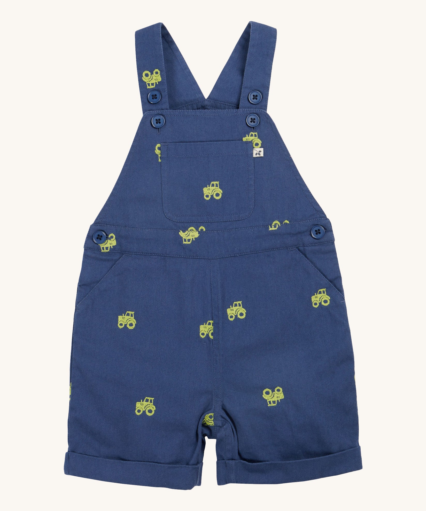 Frugi baby short navy tractor dungarees - GOTS organic cotton baby dungarees in navy blue with a button settings on the shoulder straps for easy fitting. Features a yellow tractor embroidery all over the dungarees.