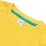 Close up of the Frugi kids bumblebee okapi short sleeve t-shirt. showing the yellow neck trim and green trim on the inside of the neck on yellow organic cotton fabric