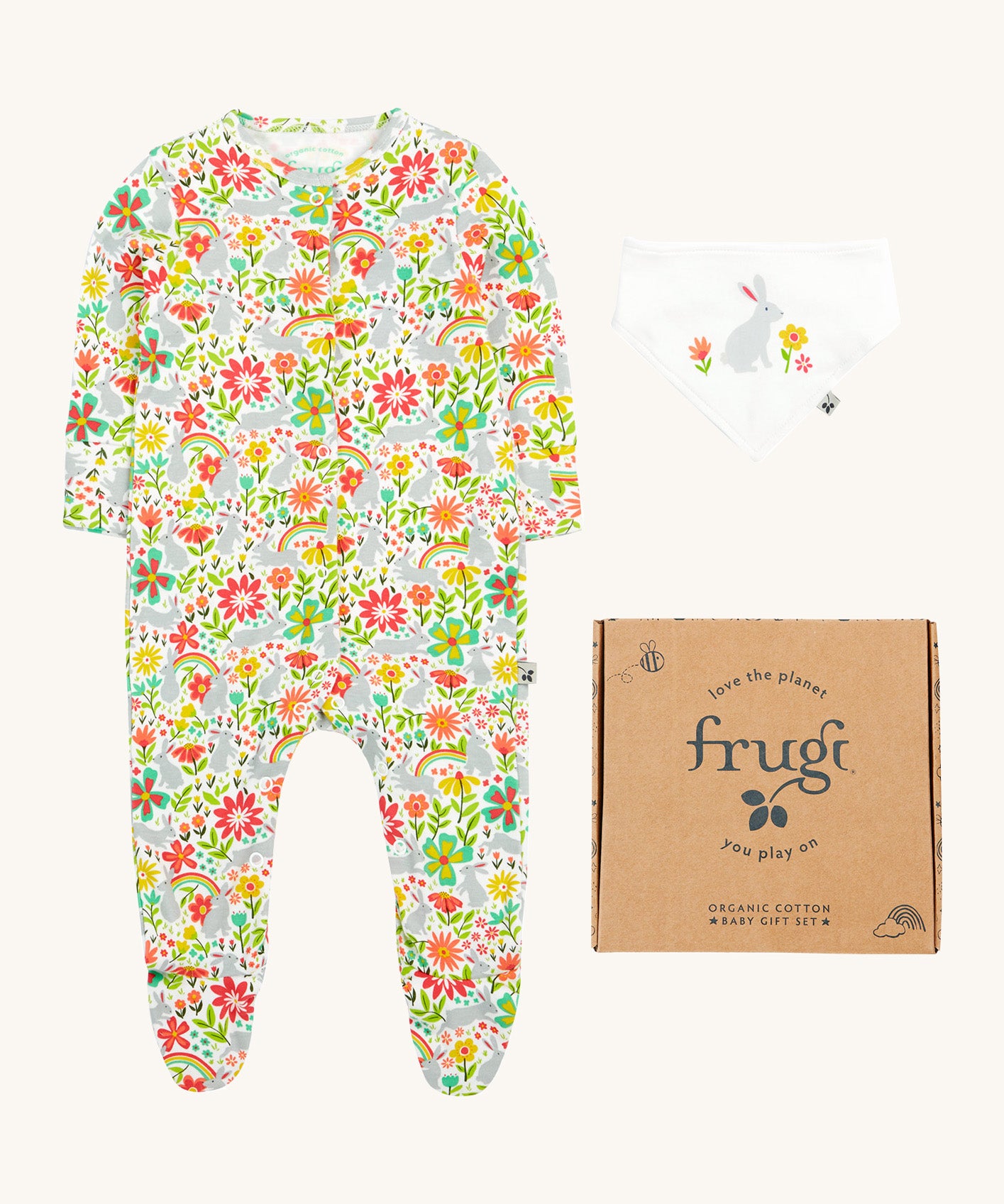 Frugi baby peony bunny gift set - GOTS organic cotton baby gift set. Features a babygrow with grey bunny rabbits and a collection of coloured flowers with a matching white bib with a grey rabbit. Includes a decorated cardboard box.