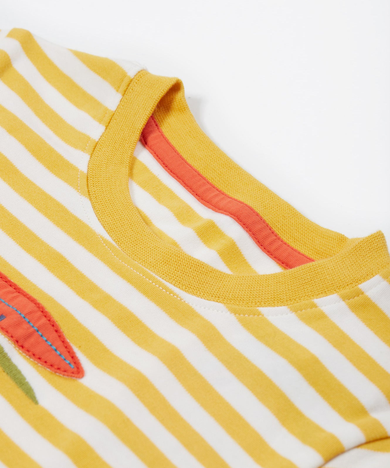 Close up of the Frugi campervan short sleeve t-shirt. Showing the neck detail on yellow and white striped organic cotton fabric 