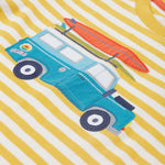 Close up of the Frugi campervan short sleeve t-shirt. Showing a blue camper van appliqué tractor with a orange surfboard on top on a yellow and white striped organic cotton fabric 