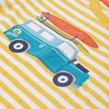 Close up of the Frugi campervan short sleeve t-shirt. Showing a blue camper van appliqué tractor with a orange surfboard on top on a yellow and white striped organic cotton fabric 