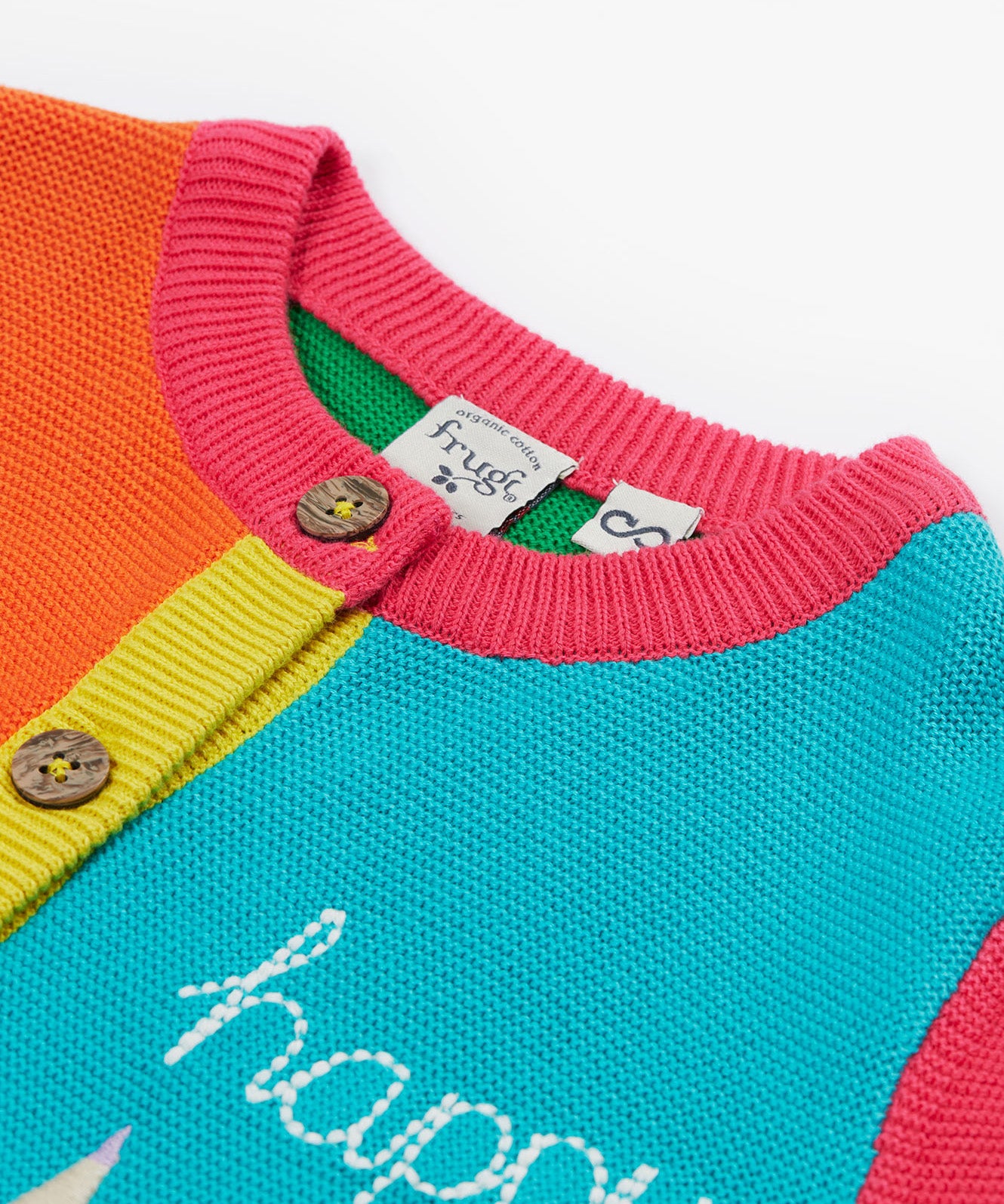 Close up of the Frugi kids Rose pocket cardigan, happy pen pot. Showing the button detail and pink neck trim on organic knitted fabric