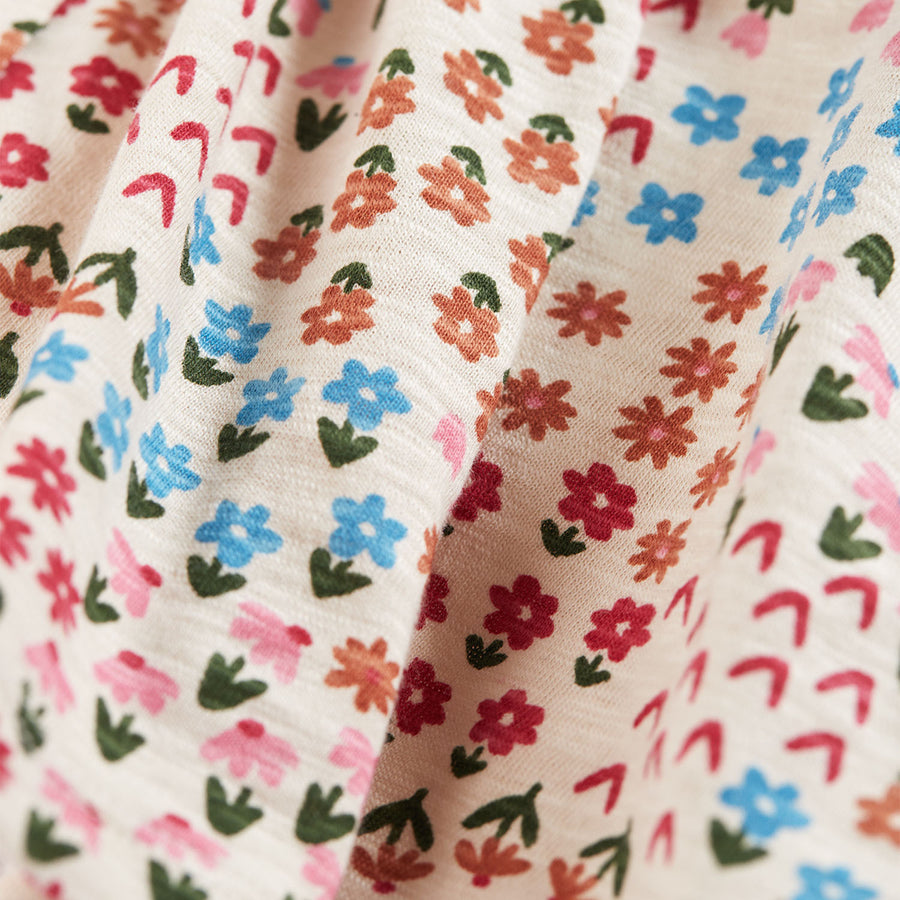 Material and pattern detail on the Frugi Marta Dress - Floral Fun.