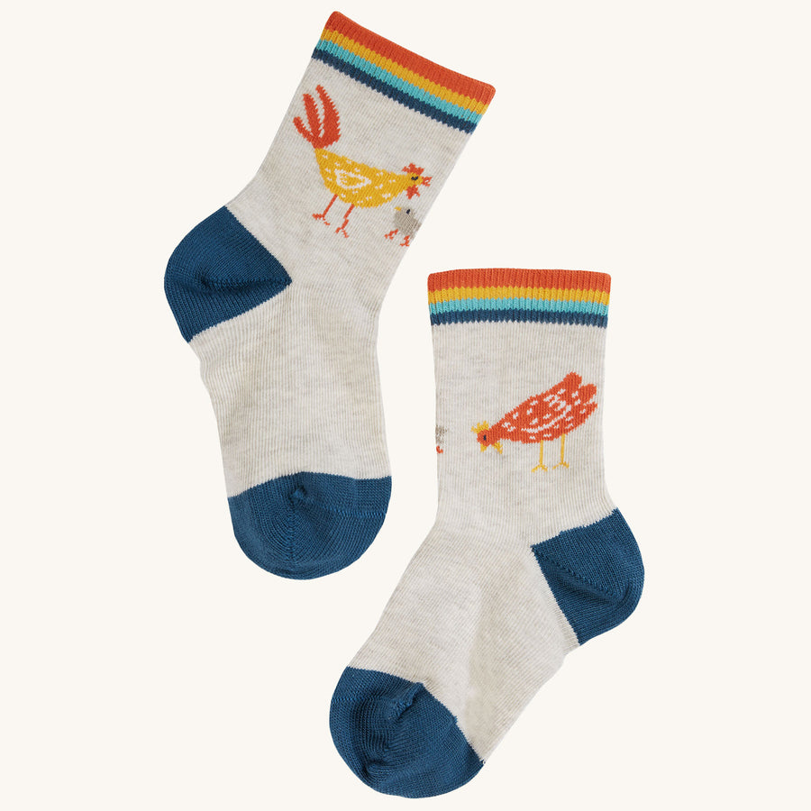 A pair of chicken socks from the Frugi Little Socks 3-Pack - Farmyard on a plain background.