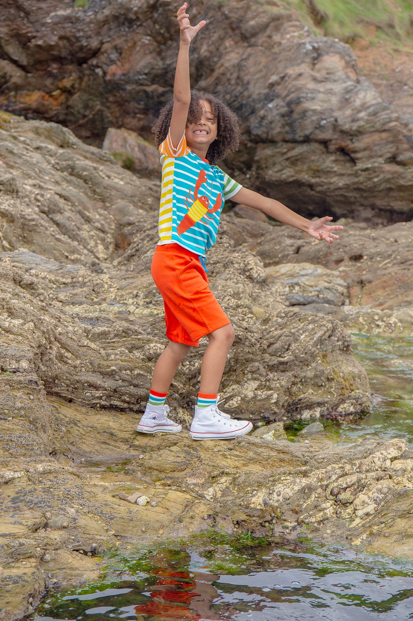 The back of the Frugi Children's Organic Cotton Hotchpotch Applique T-Shirt - Lobster. A colourful multi stripe Frugi T-Shirt made from organic cotton