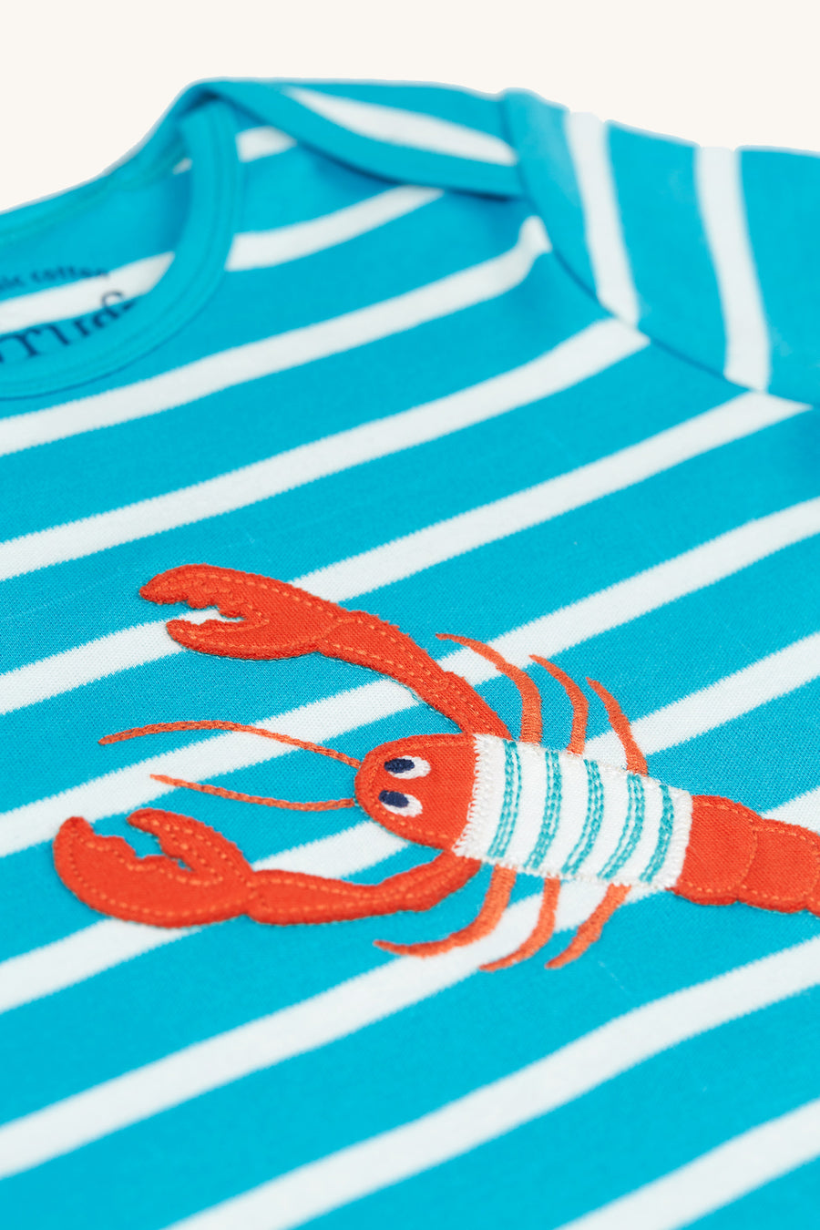  with poppers along the crotch. The lobster is also wearing a blue and white stripy top too!