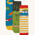 Frugi kids crocodile rock my socks 3 pack - GOTS organic cotton socks which features a teal sock with crocodiles, a green crocodile sock and a yellow and white stripe sock with a campervan.