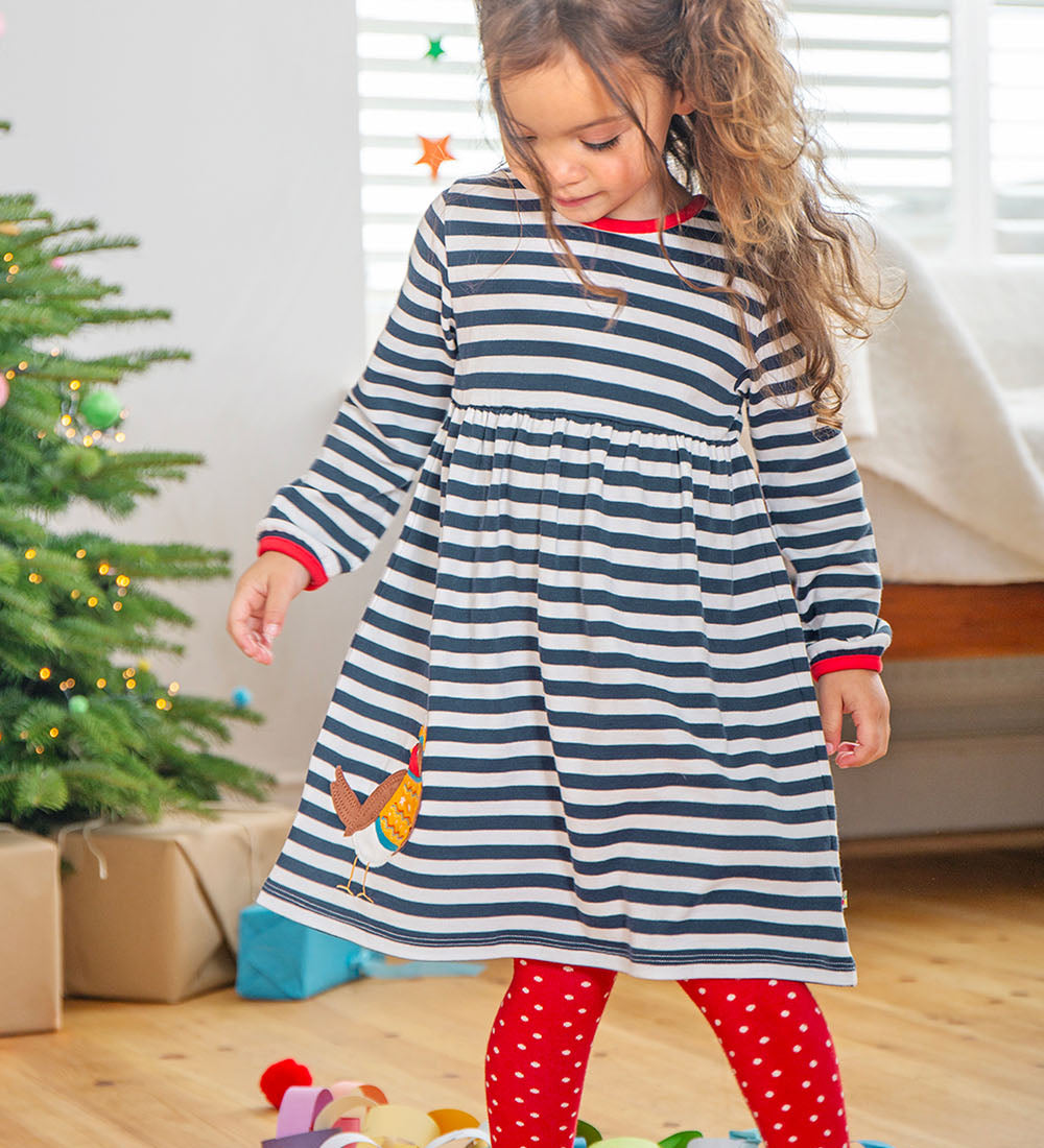 a child wearing frugi dea dress 