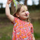 A child wearing the Frugi Donkey Drove Ellen Dress. 