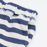 Close up of the shorts from the Frugi easy  on llama outfit showing the pocket detail and waist hem on blue and white stripe organic cotton fabric