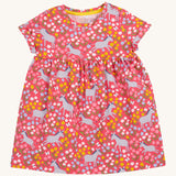 Frugi kids Ellen dress donkey drove - GOTS organic cotton Frugi kids dress with short turned up sleeve in pink. Features grey donkeys surrounded by yellow white pink and light blue flowers. 