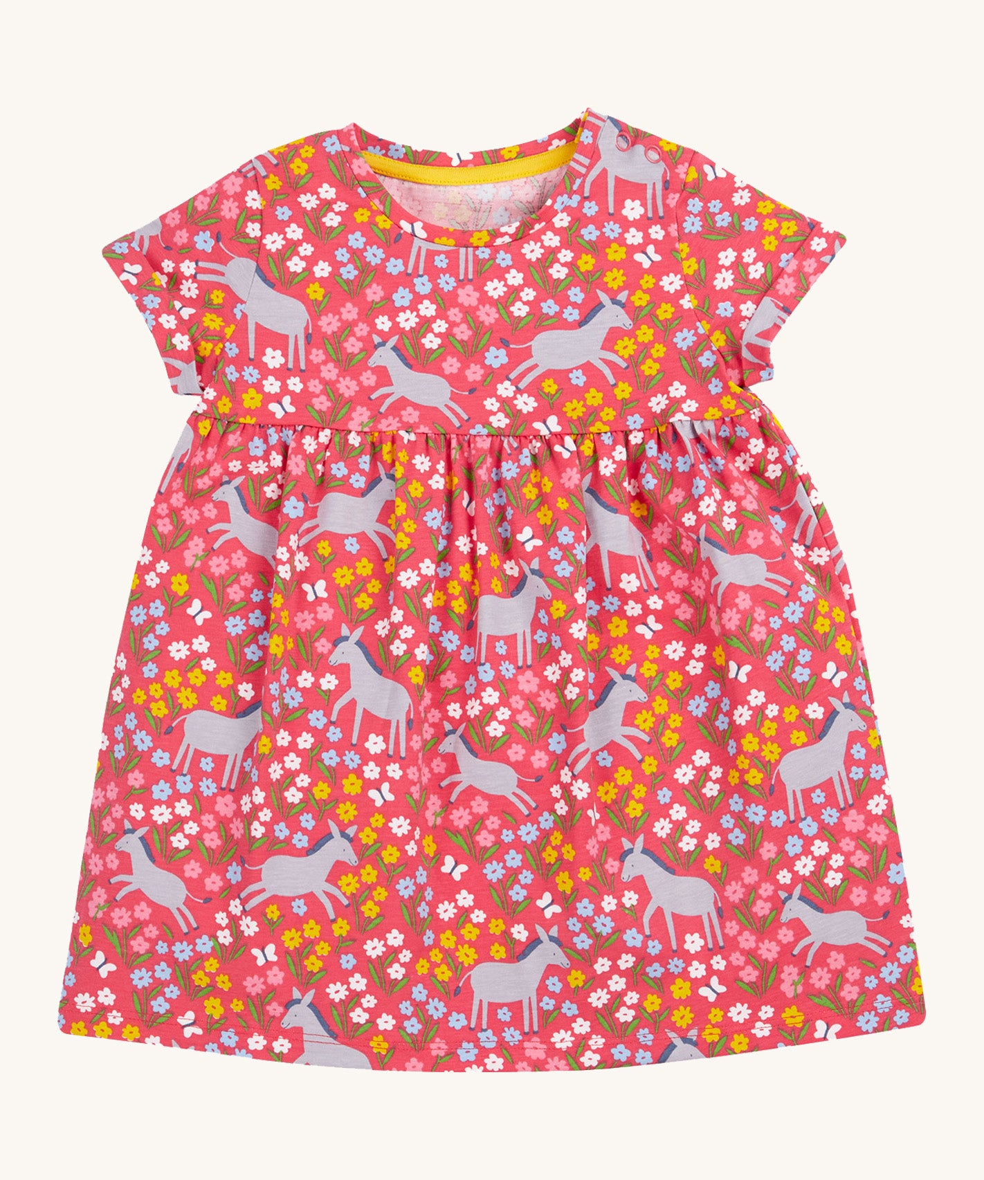 Frugi kids Ellen dress donkey drove - GOTS organic cotton Frugi kids dress with short turned up sleeve in pink. Features grey donkeys surrounded by yellow white pink and light blue flowers. 