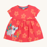 Frugi kids flora fun koala tunic top - GOTS organic cotton kids tunic top in light pink with pastel orange floral prints, short sleeves and popper fasteners on the shoulder for easy fitting. Features and applique of a grey koala next to bamboo shoots.