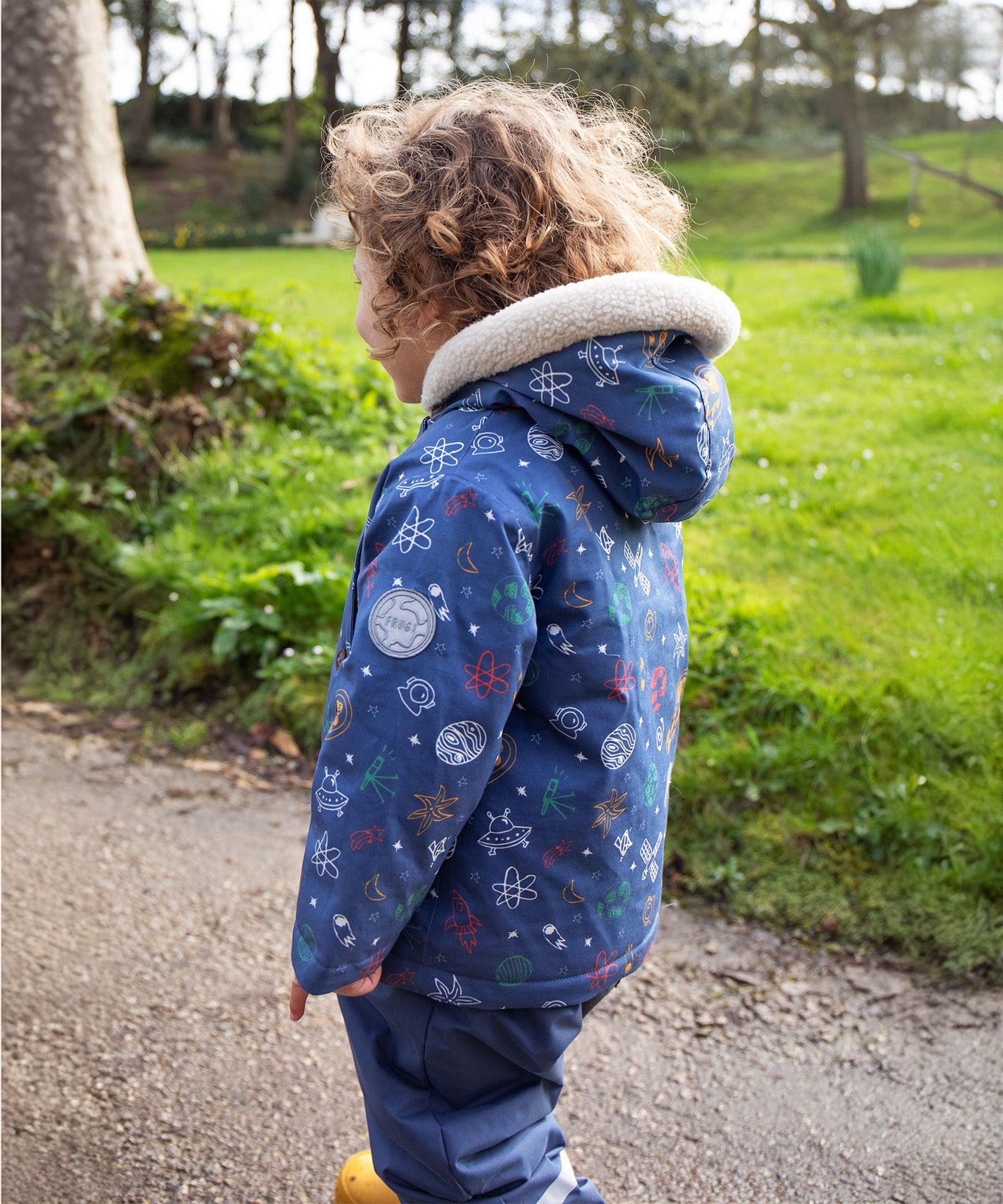  showing the fleece lining on the Frugi Little Penhale Parka - Dream Big/Navy