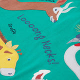 A close up of the Frugi kids long neck pals t-shirt. Showing the different long necked animals appliqué including a giraffe and gerenuk with long neck slogan across the t-shirt and animal names on green organic cotton fabric