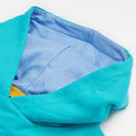 A close up of the Frugi kids oversized blue panda hoodie. Showing the light organic cotton blue lining