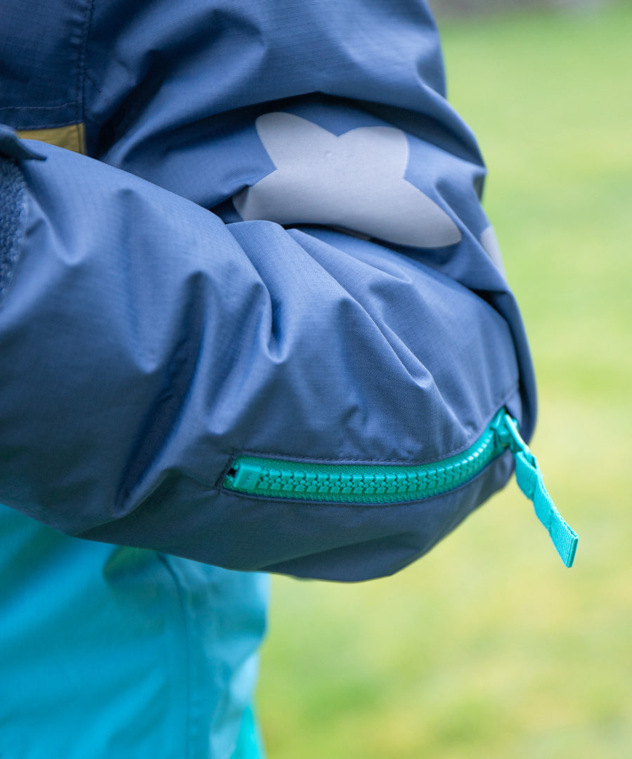 The secret snacks pocket inside the Frugi Snow & Ski Coat - Iguana Colourblock