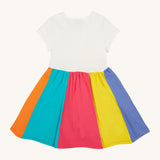 Frugi kids jersey rainbow dress - GOTS organic cotton kids dress with a white top half and a rainbow block colour bottom half.