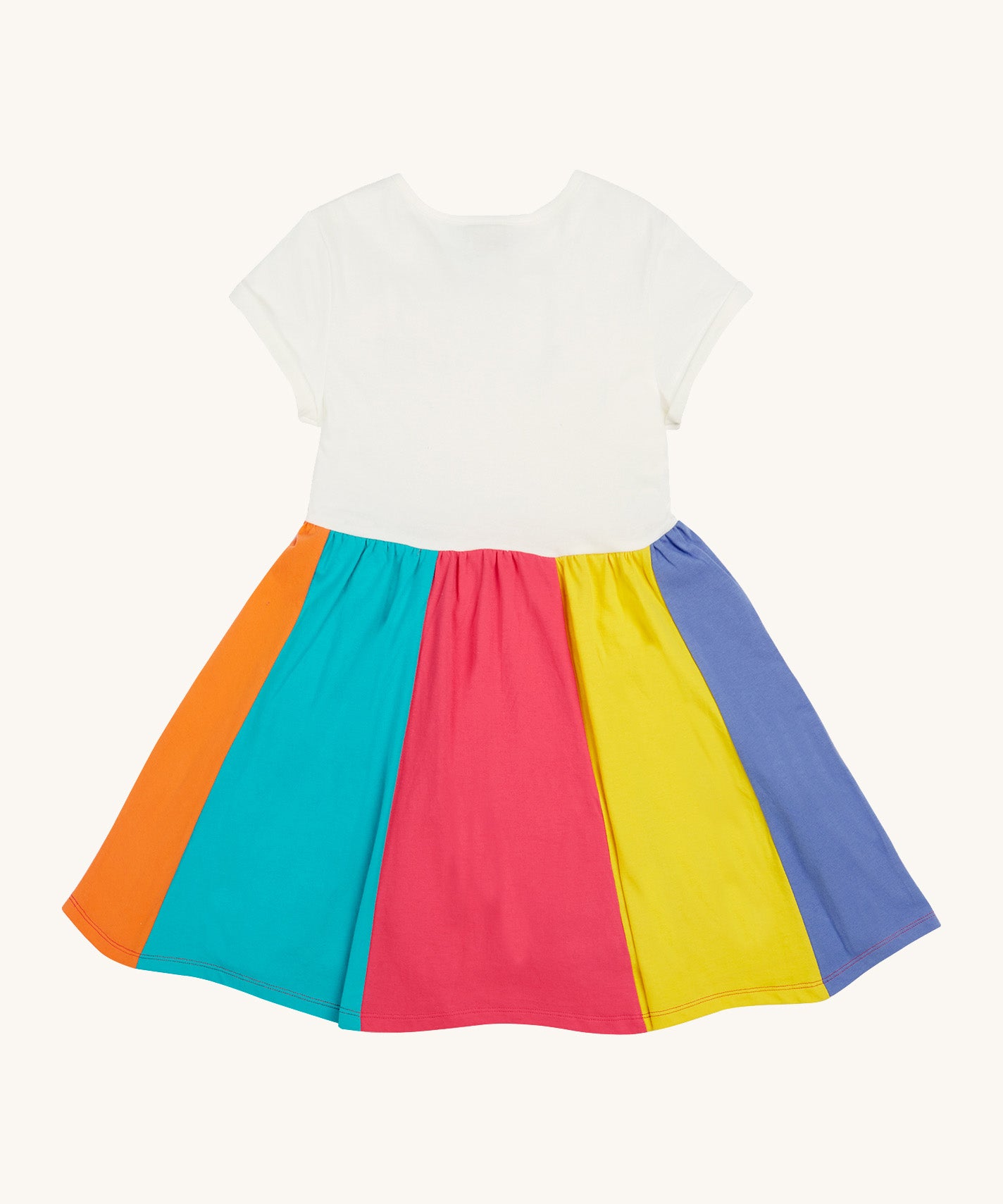 Frugi kids jersey rainbow dress - GOTS organic cotton kids dress with a white top half and a rainbow block colour bottom half.