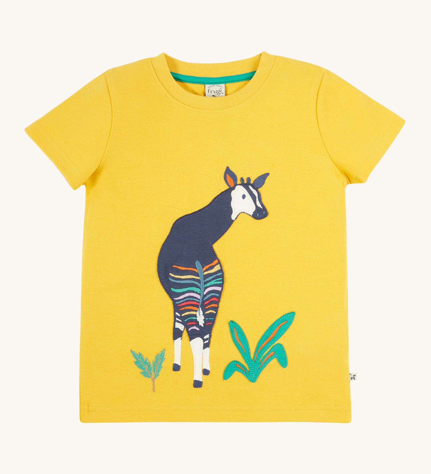 Frugi kids bumblebee okapi character t-shirt - GOTS organic cotton Frugi kids t-shirt in yellow with short sleeves and a green trim on the inside of the neck. Features an appliqué of a okapi animal on thefron next to some green plants