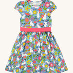 Frugi kids bunny bounce skater dres - GOTS organic kids skater dress in pastel blue, sleeveless with a pink bow waist band. Features a print of different bunnies and coloured flowers.