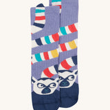 Frugi kids character sock showing the navy lemur design with a multicoloured stripe tail on a light purple organic cotton fabric