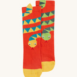 Frugi kids character socks showing a yellow snake with blue patterns and a green snake with yellow toe panels on orange organic cotton fabric